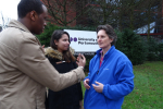Flick talking to some students outside the University of Portsmouth