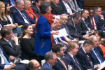 Flick speaking in Parliament